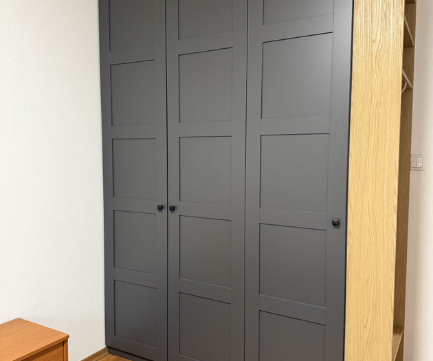 Grey wardrobe in bedroom