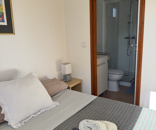 Bedroom with ensuite bathroom view