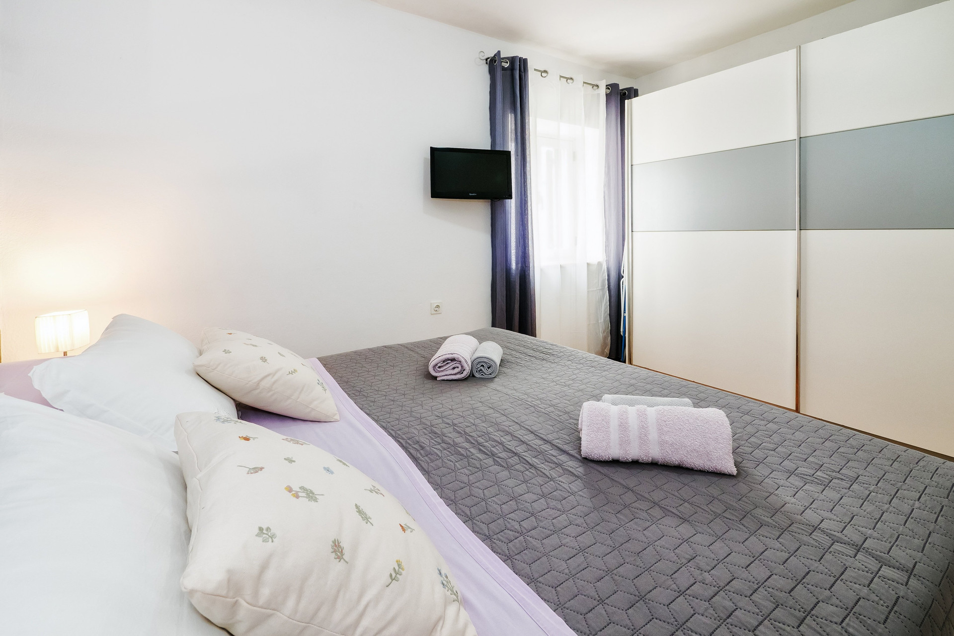 Bedroom with bed and wardrobe