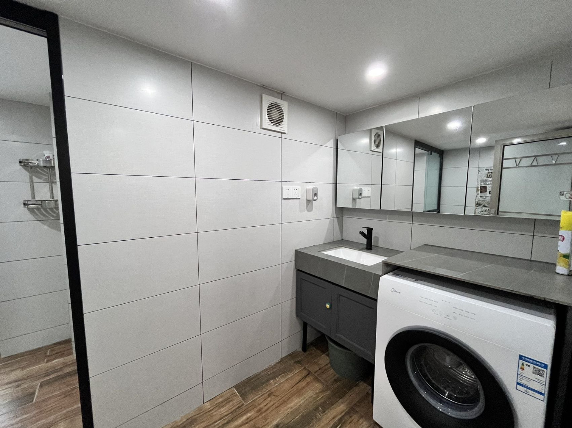 Bathroom with vanity and washer
