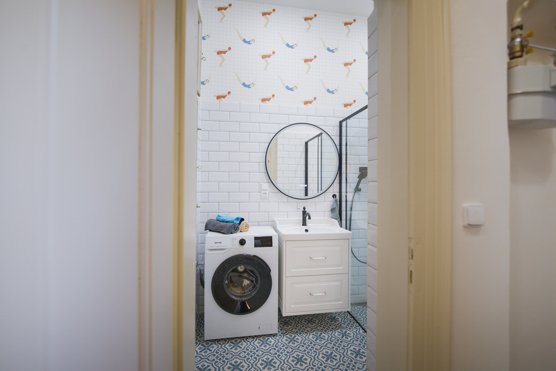 Bathroom with washer and sink