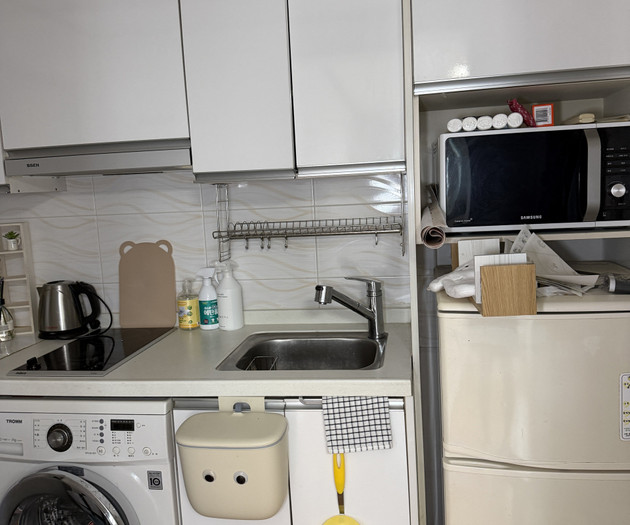 Kitchen with washer and fridge
