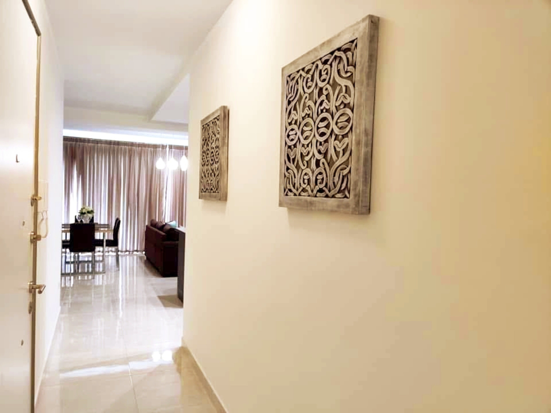 Hallway with decorative wall art