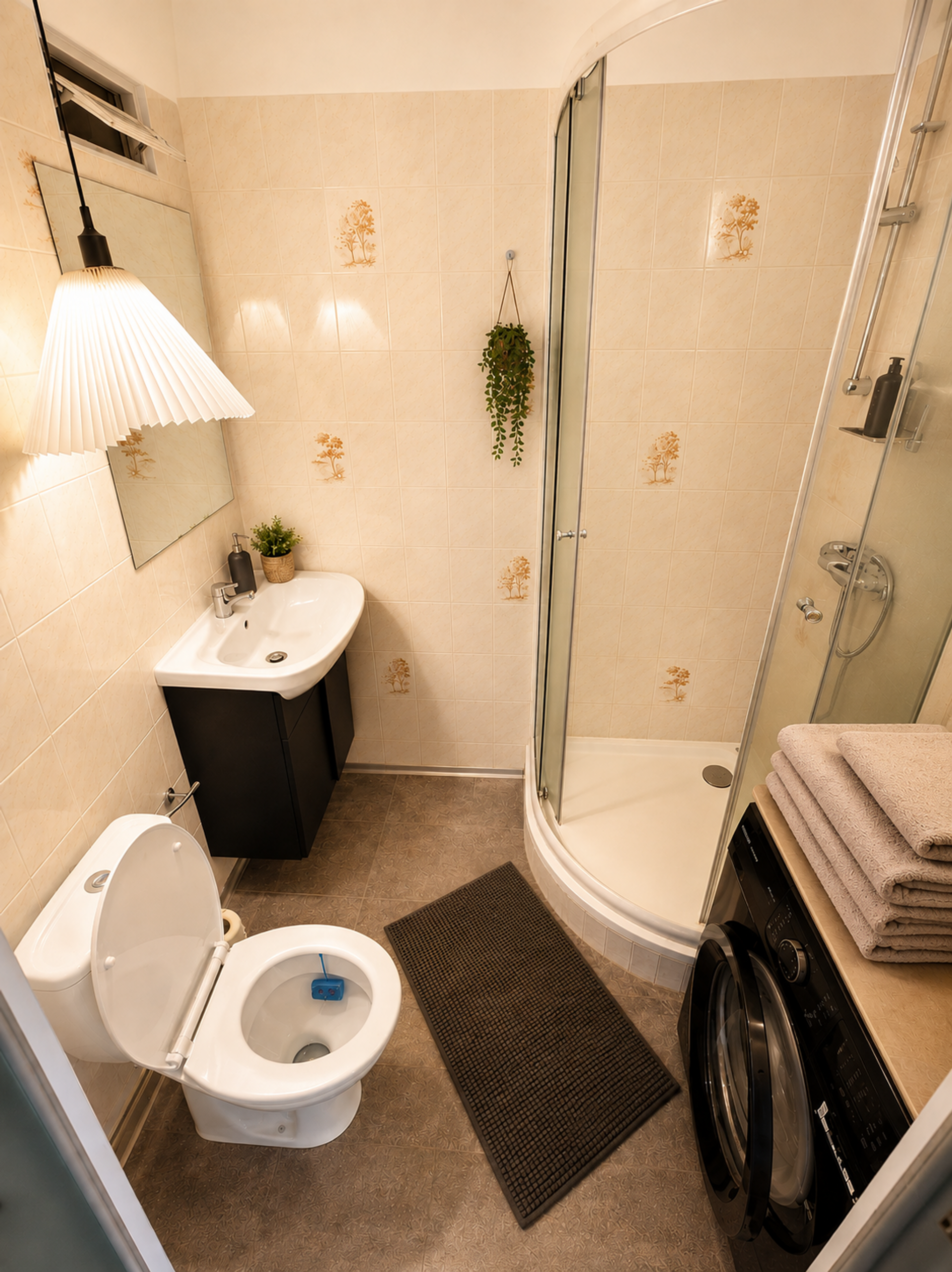 Bathroom with shower toilet washing machine