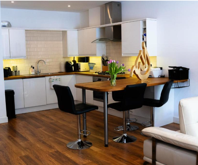 Open-plan kitchen with breakfast bar