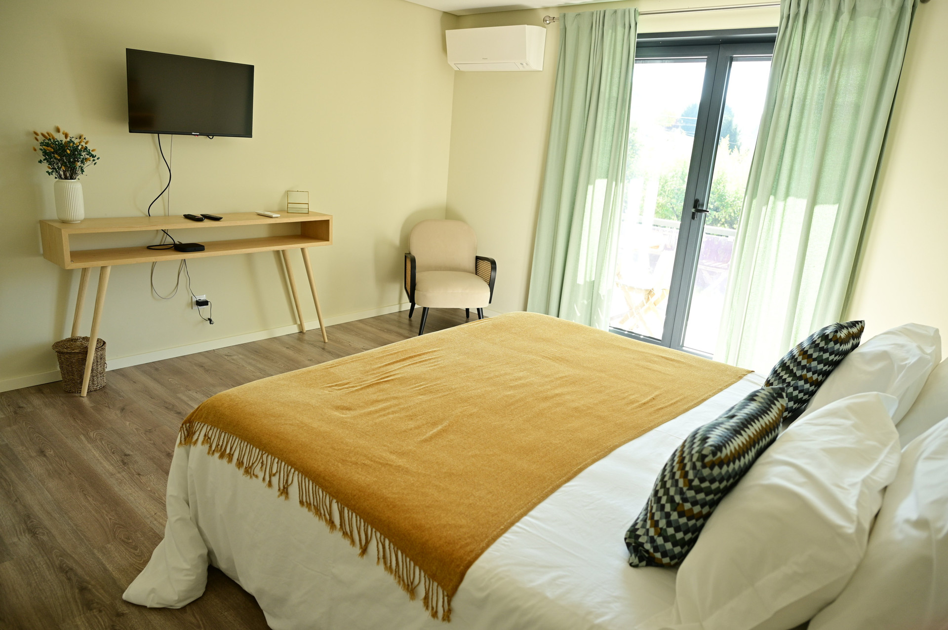 Bedroom with TV and armchair