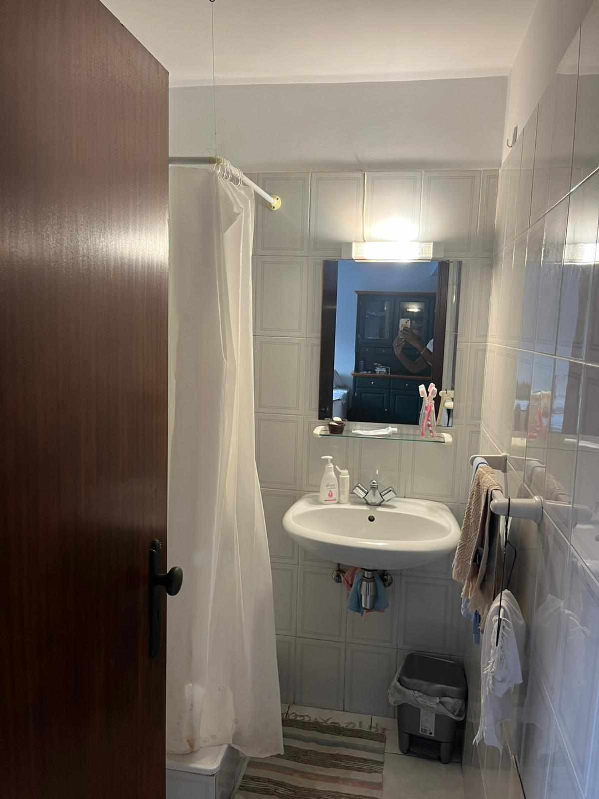 Bathroom with shower and sink