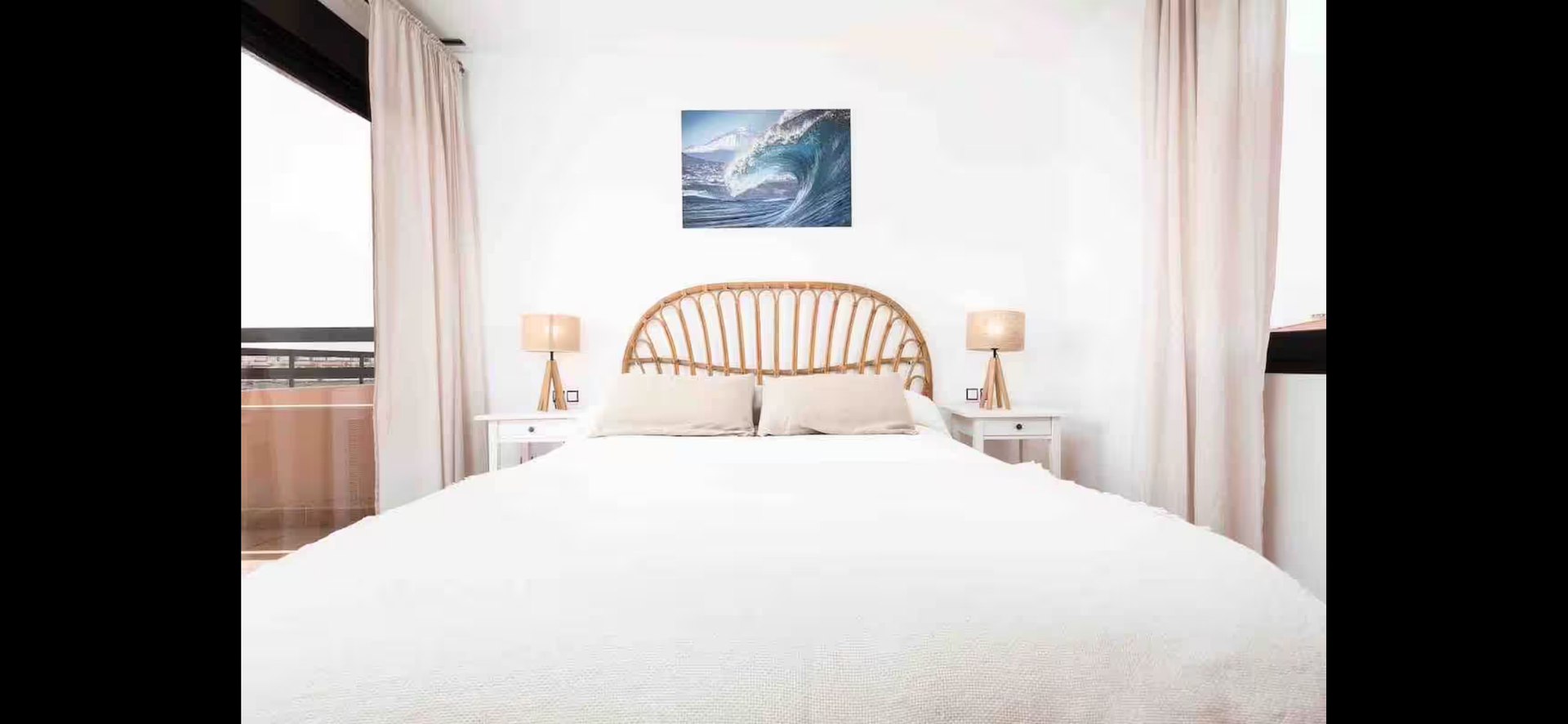 Bright bedroom with rattan headboard
