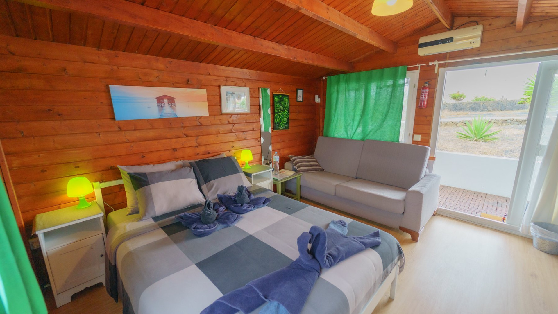 Bedroom with sofa and patio door
