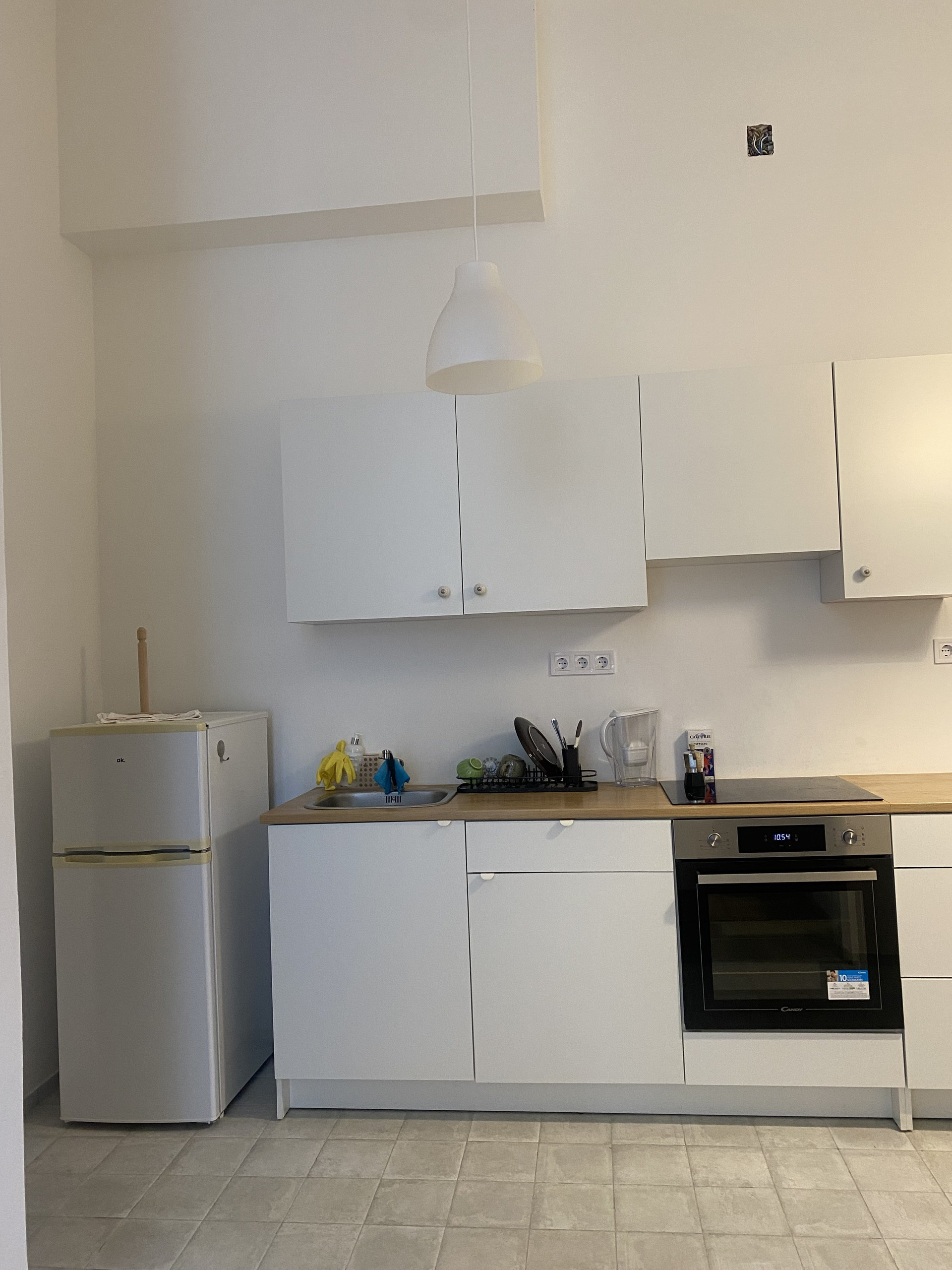 White kitchen with fridge and oven