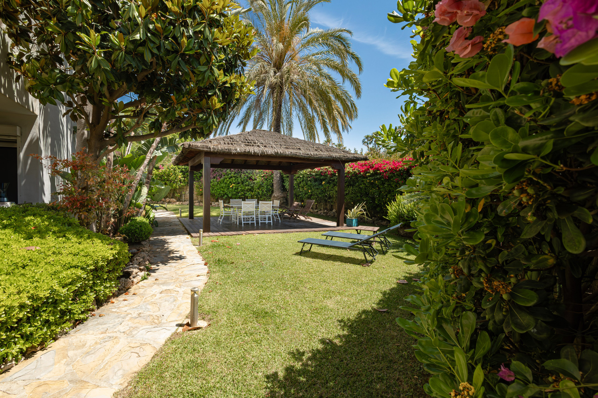 Private garden with thatched gazebo