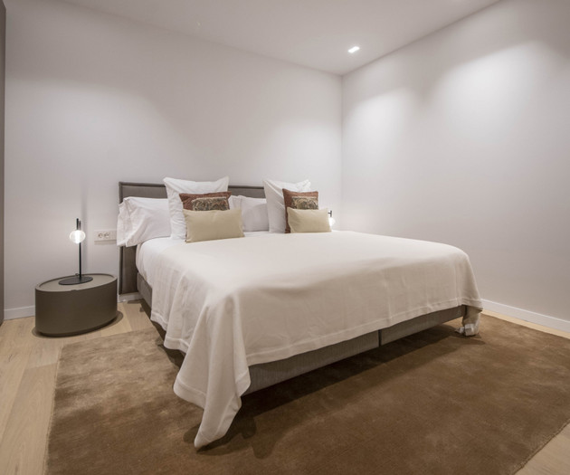 Bedroom with brown rug