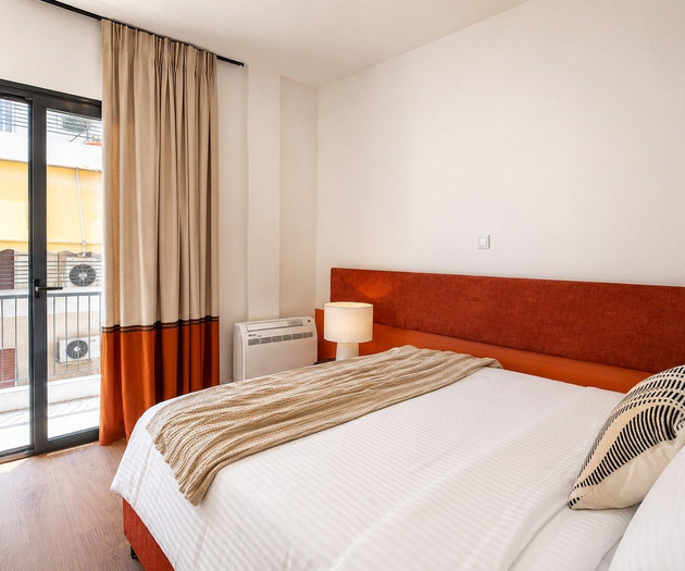 Bedroom with balcony view