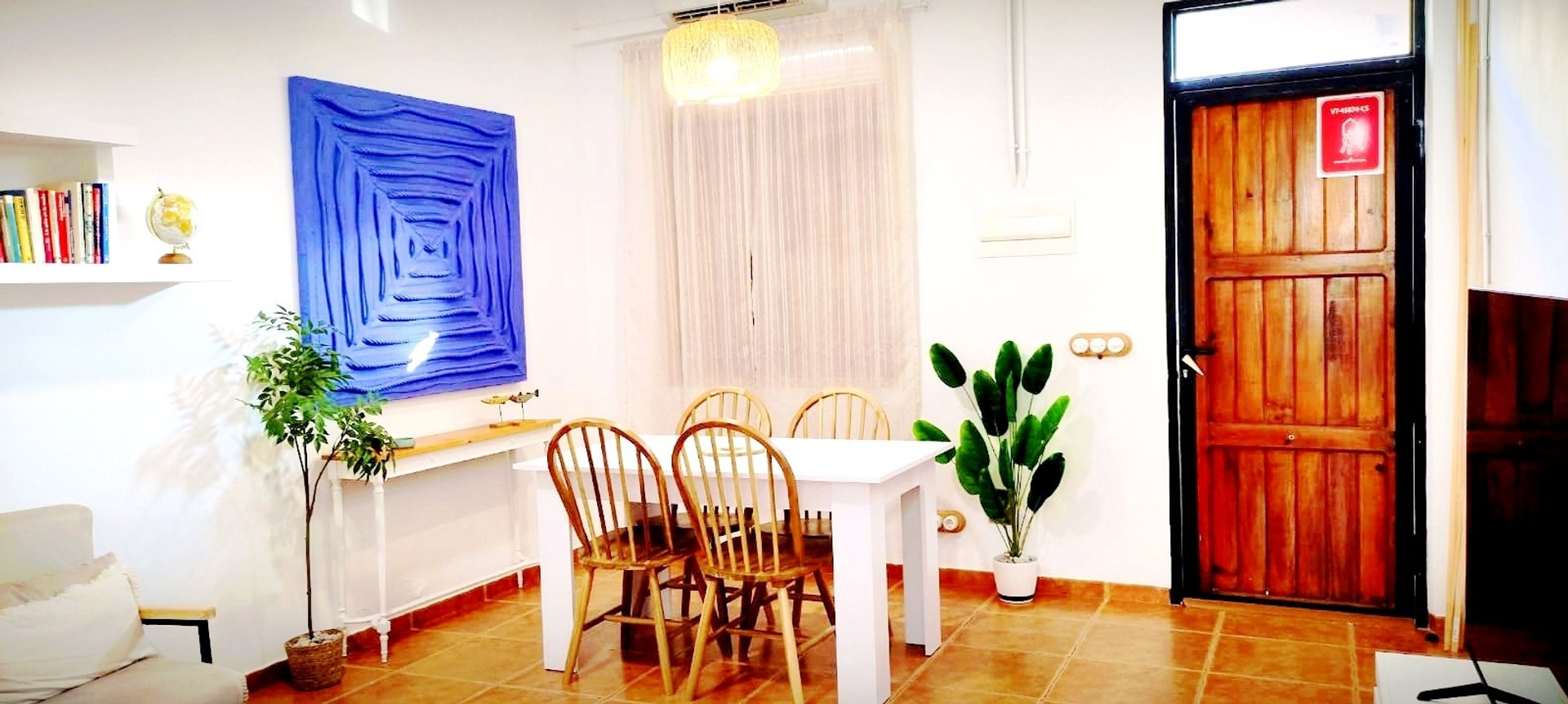 Dining area with blue artwork