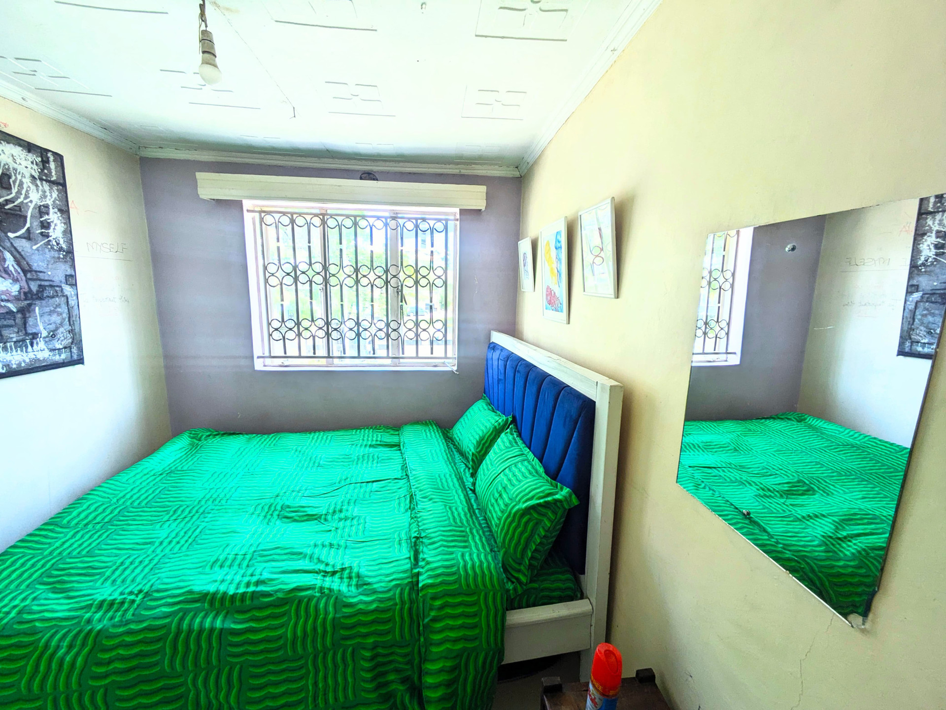 Bedroom overview with mirror