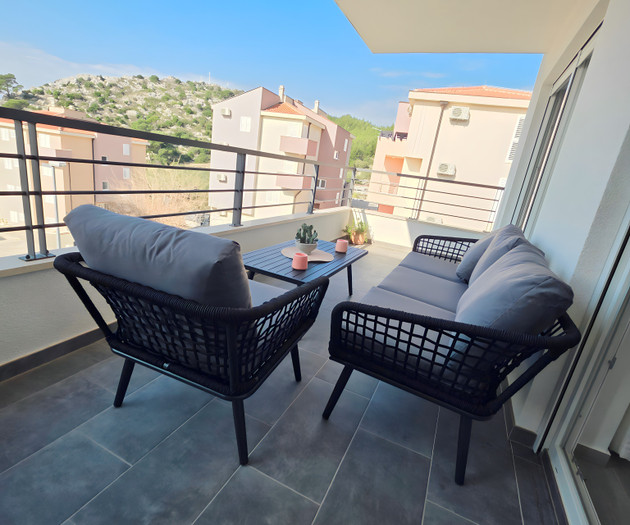 Balcony lounge with hill view