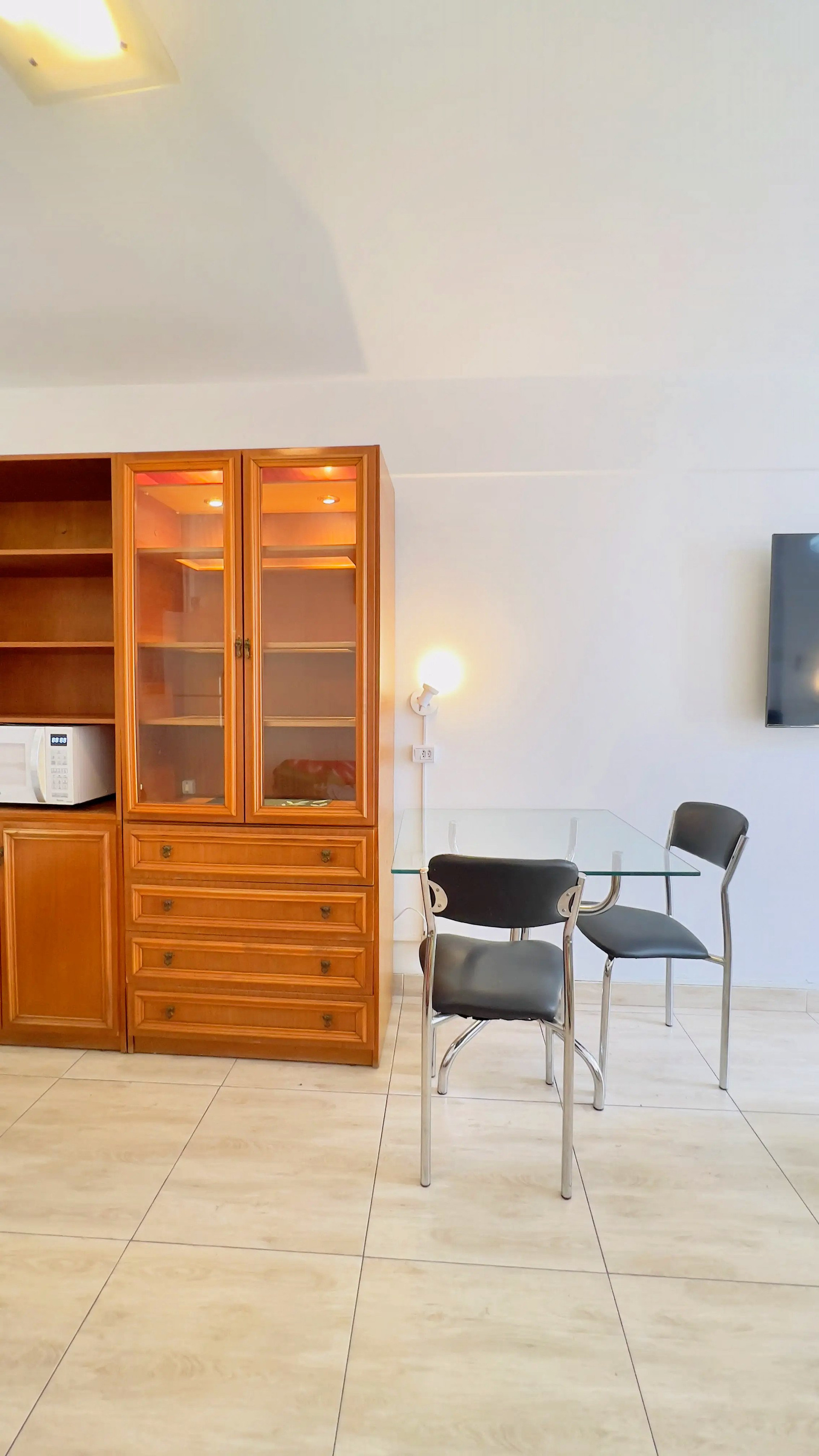 Dining area with wooden cabinet TV
