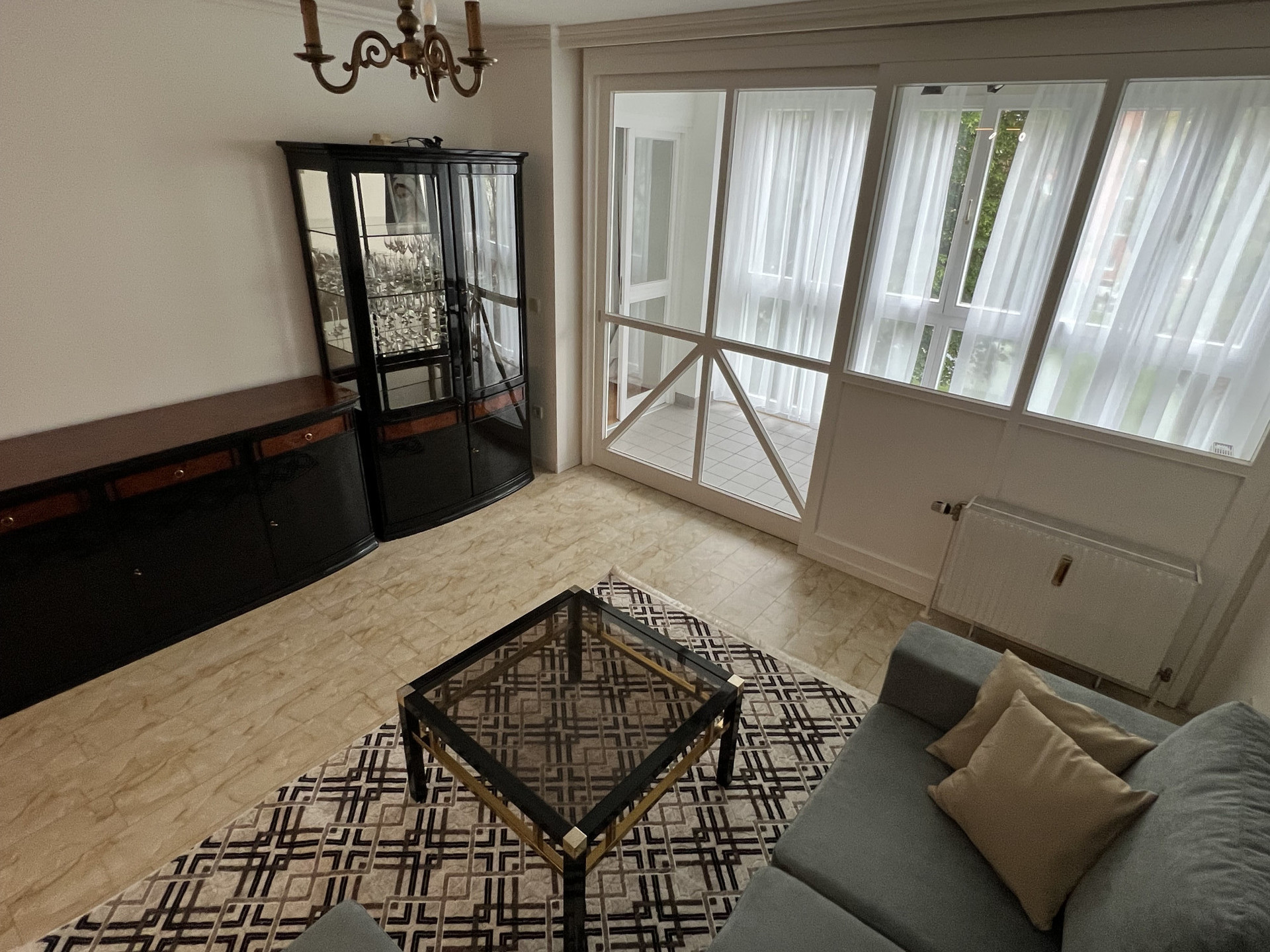 Living room with glazed loggia and sliding door