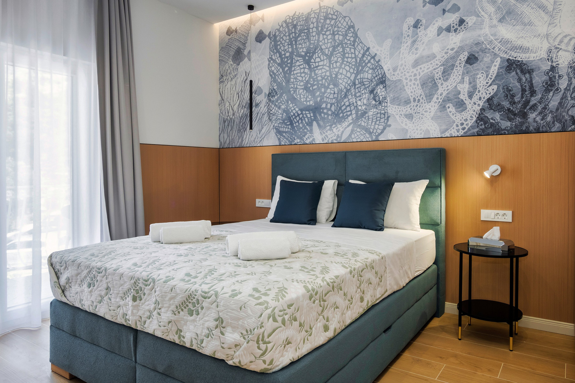 Bedroom with coral mural headboard