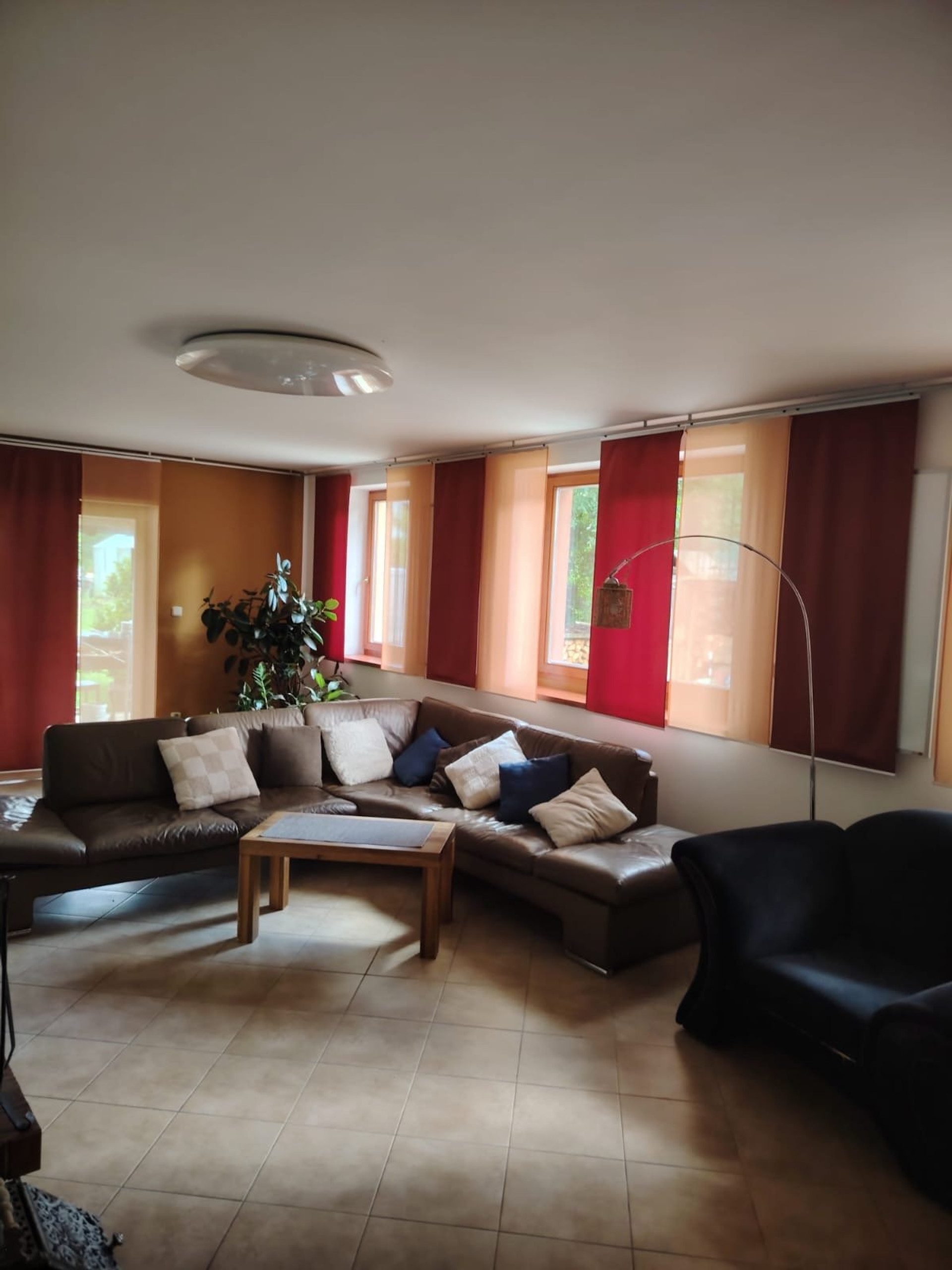 Spacious living room with leather sofa