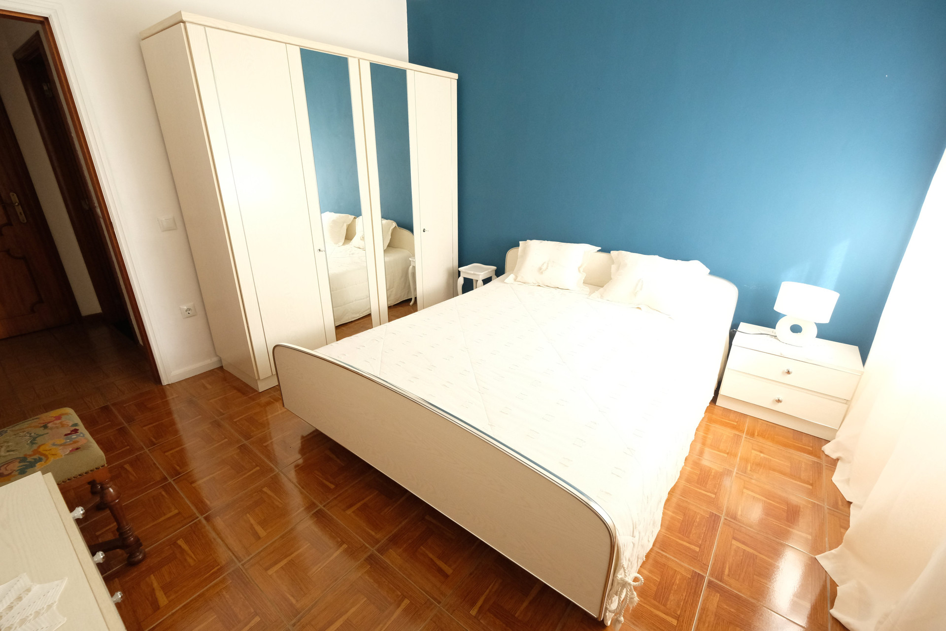 Bedroom with blue accent wall