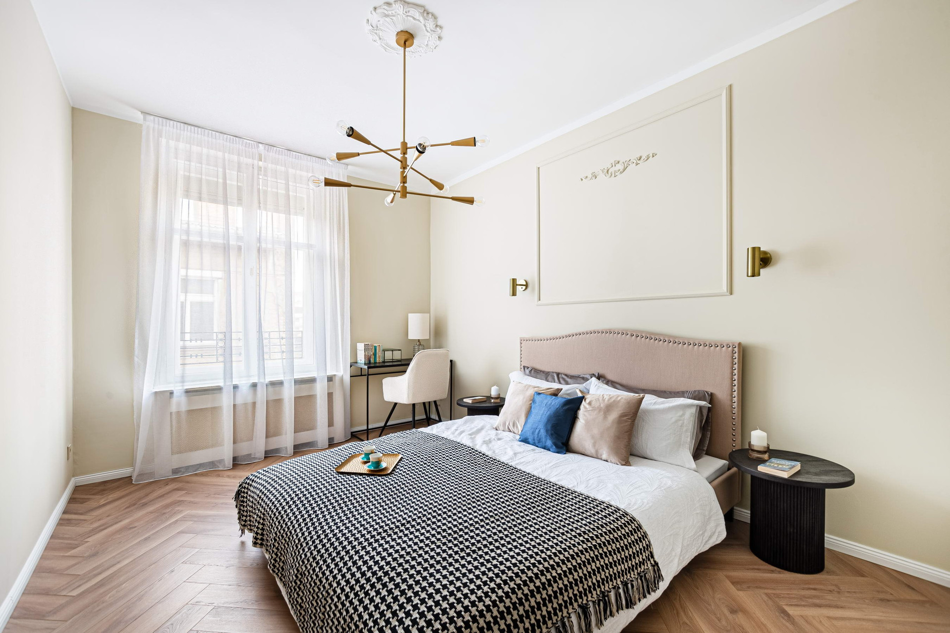 Bright bedroom with patterned throw