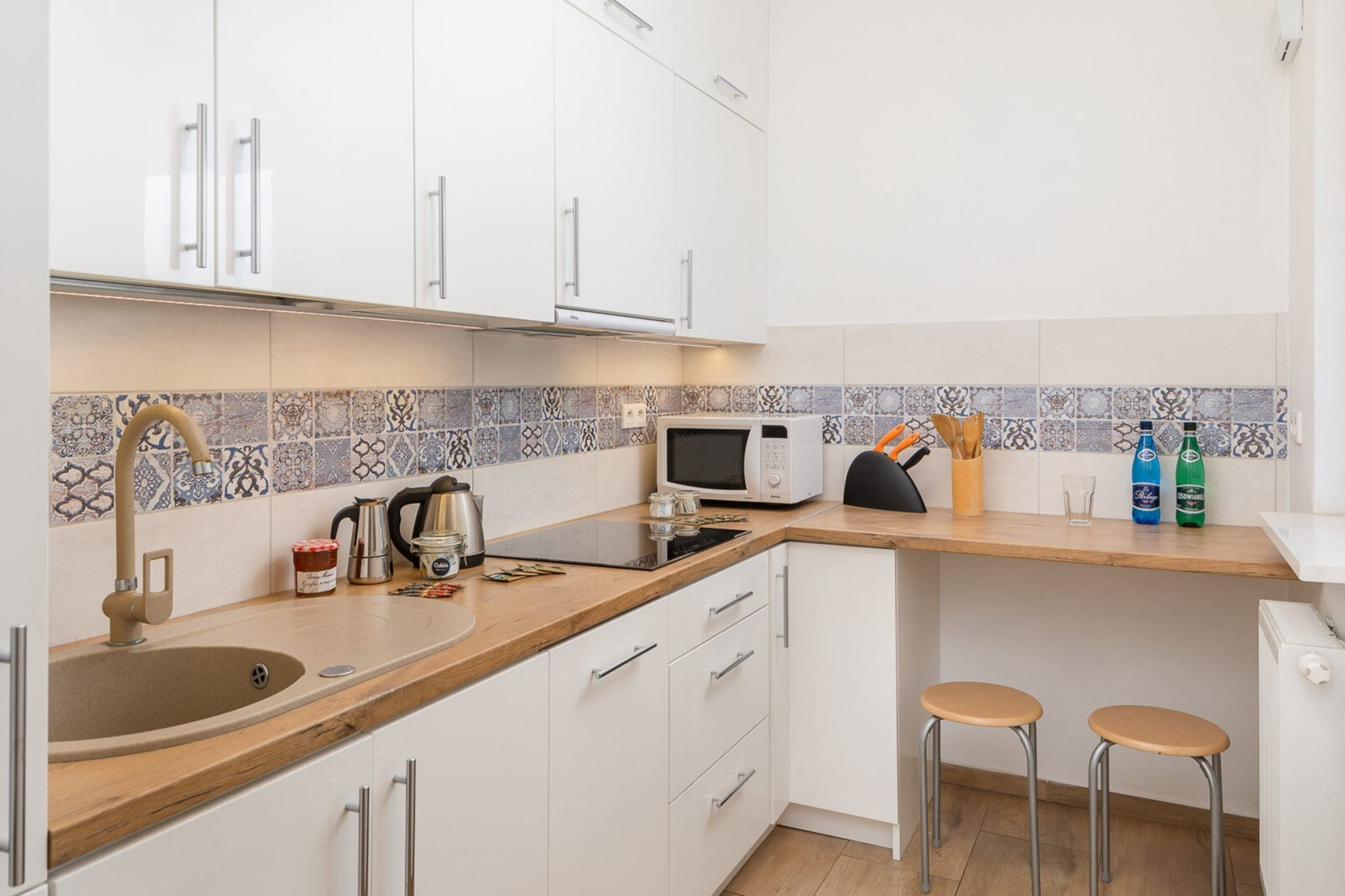 Very functional kitchen is a great place for preparing meals together.