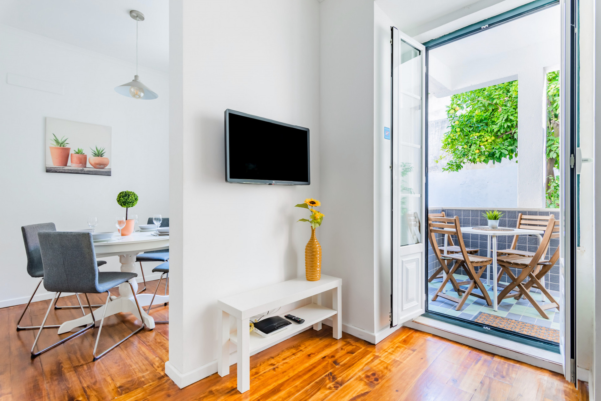 Living Room with Terrace Access and Flat-Screen TV