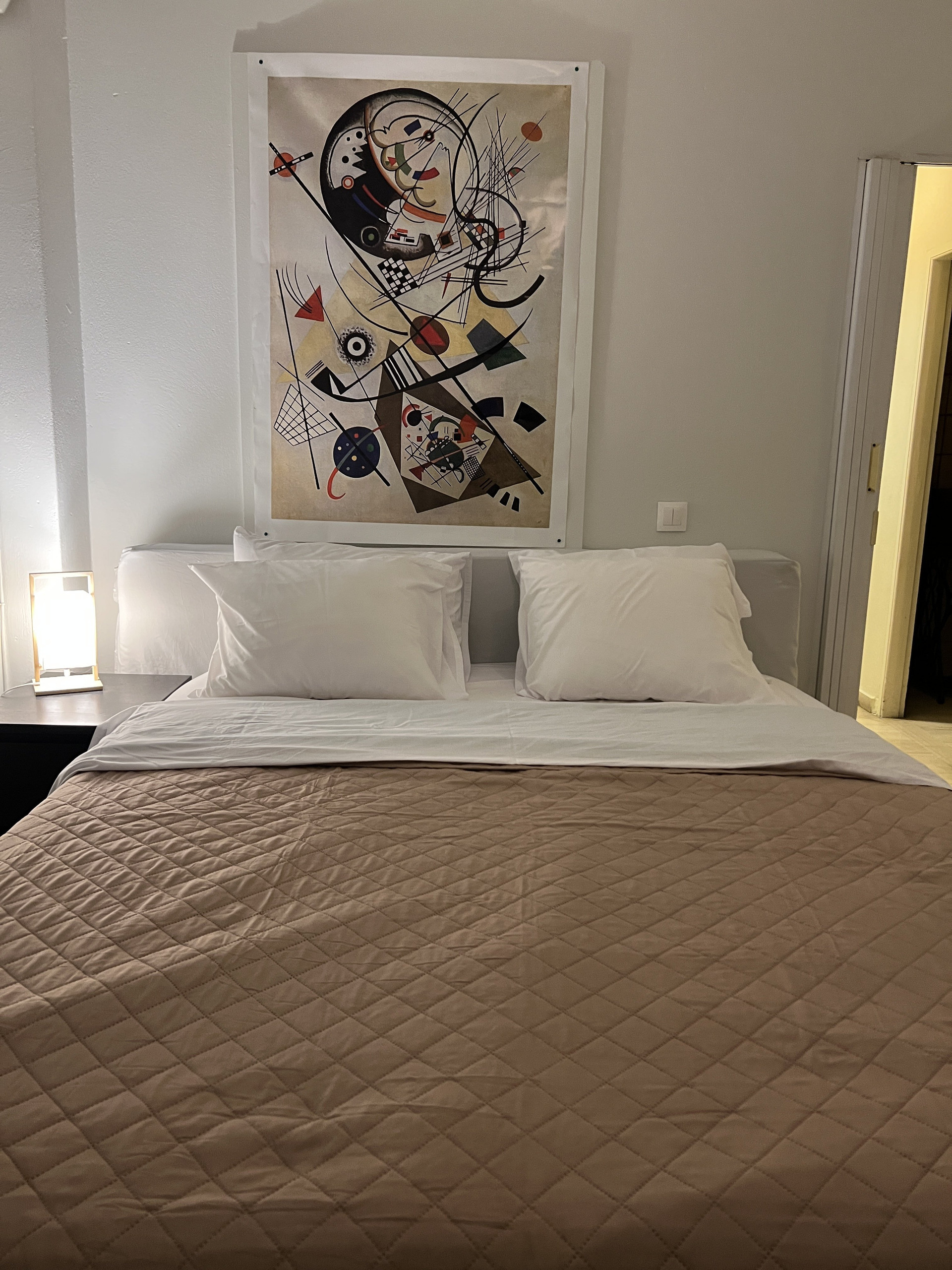 Bed with abstract artwork