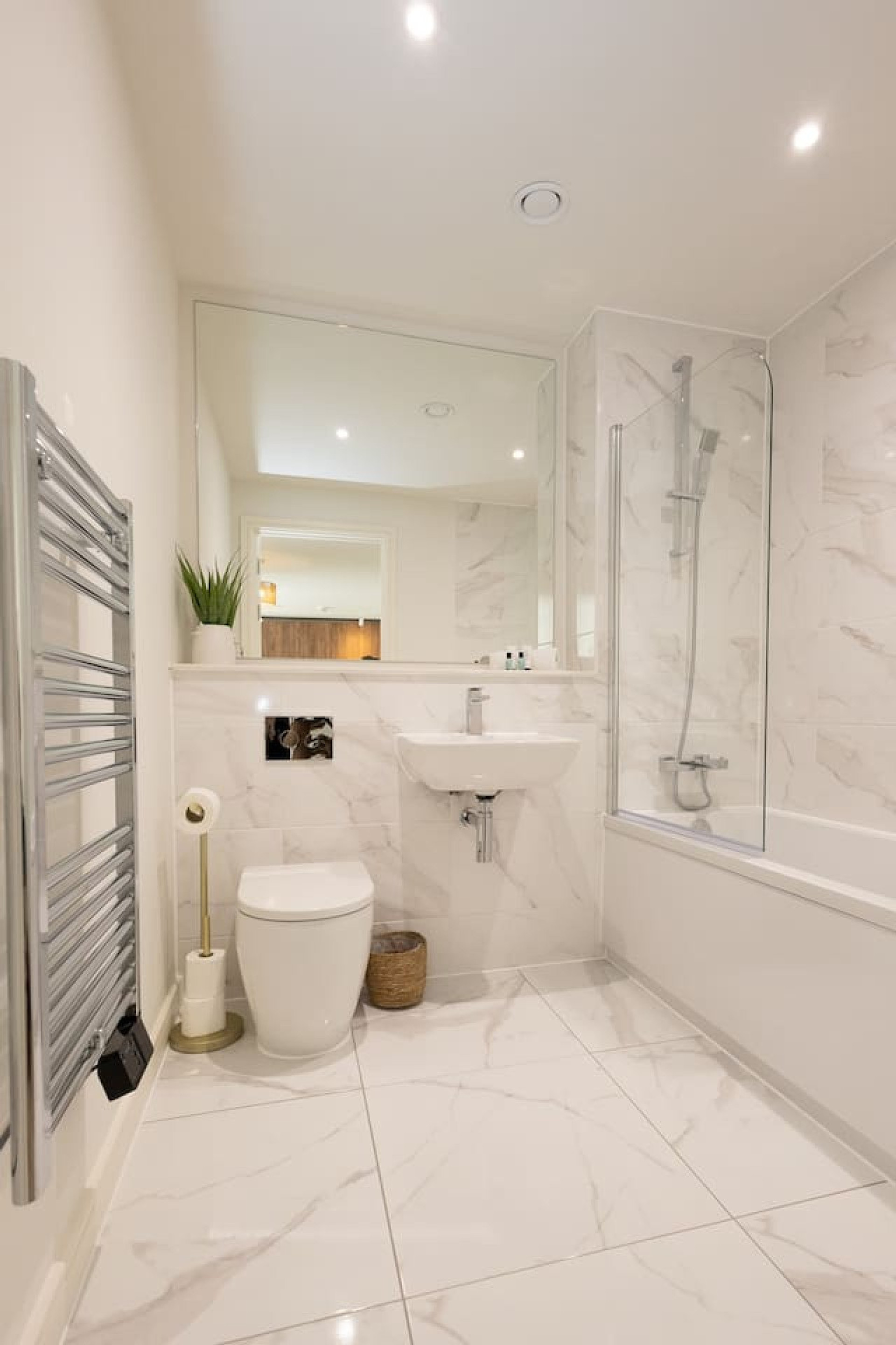 Marble bathroom with bathtub shower