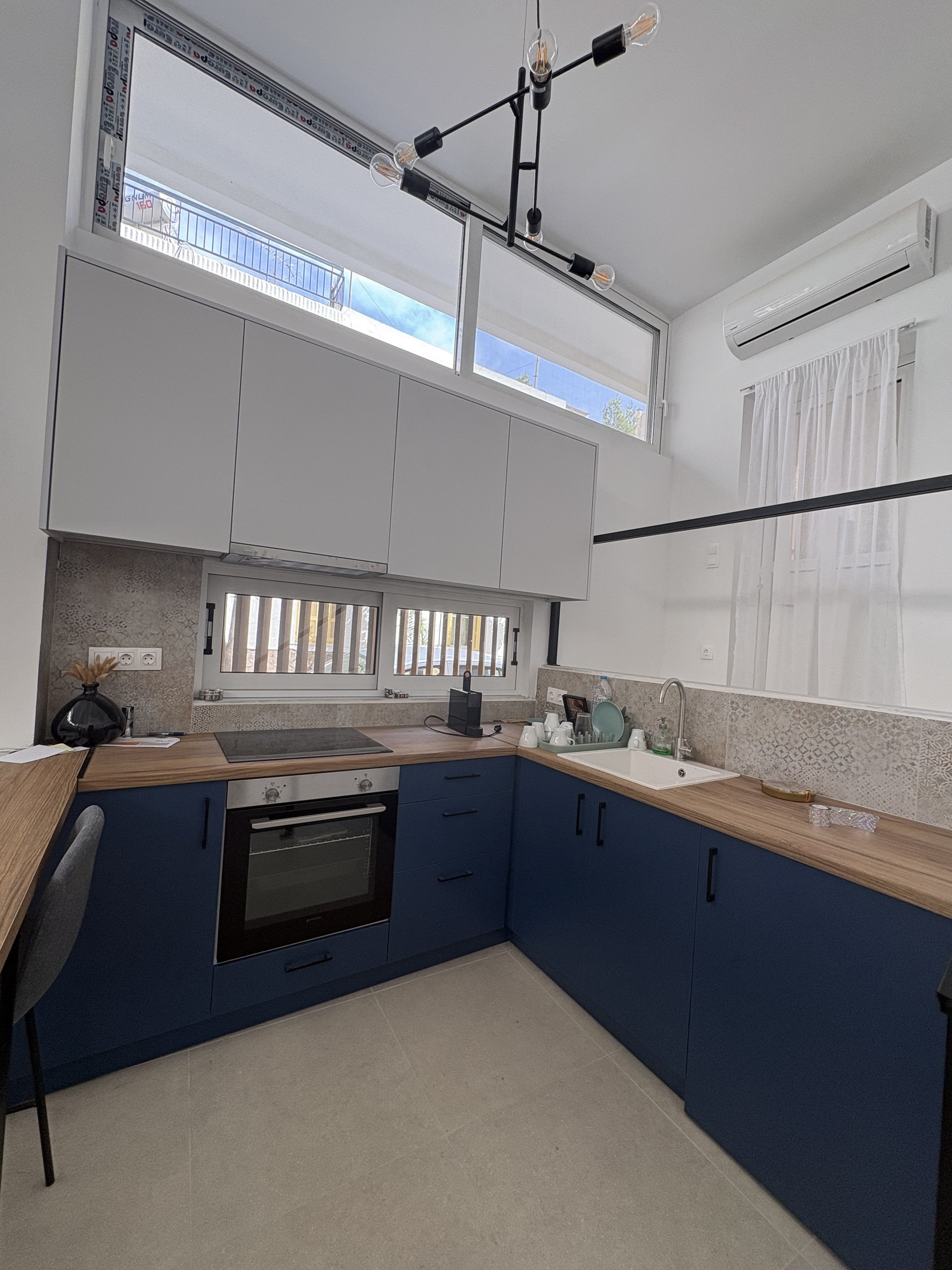 Blue kitchen with wood countertops