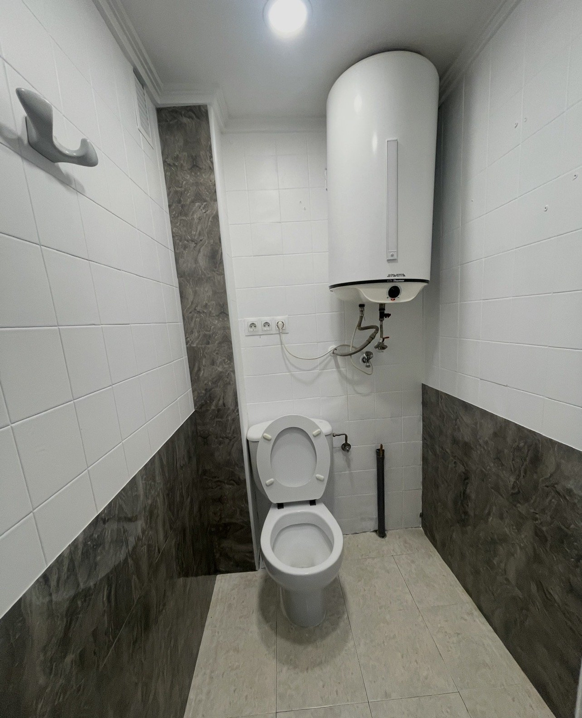 Small toilet with water heater