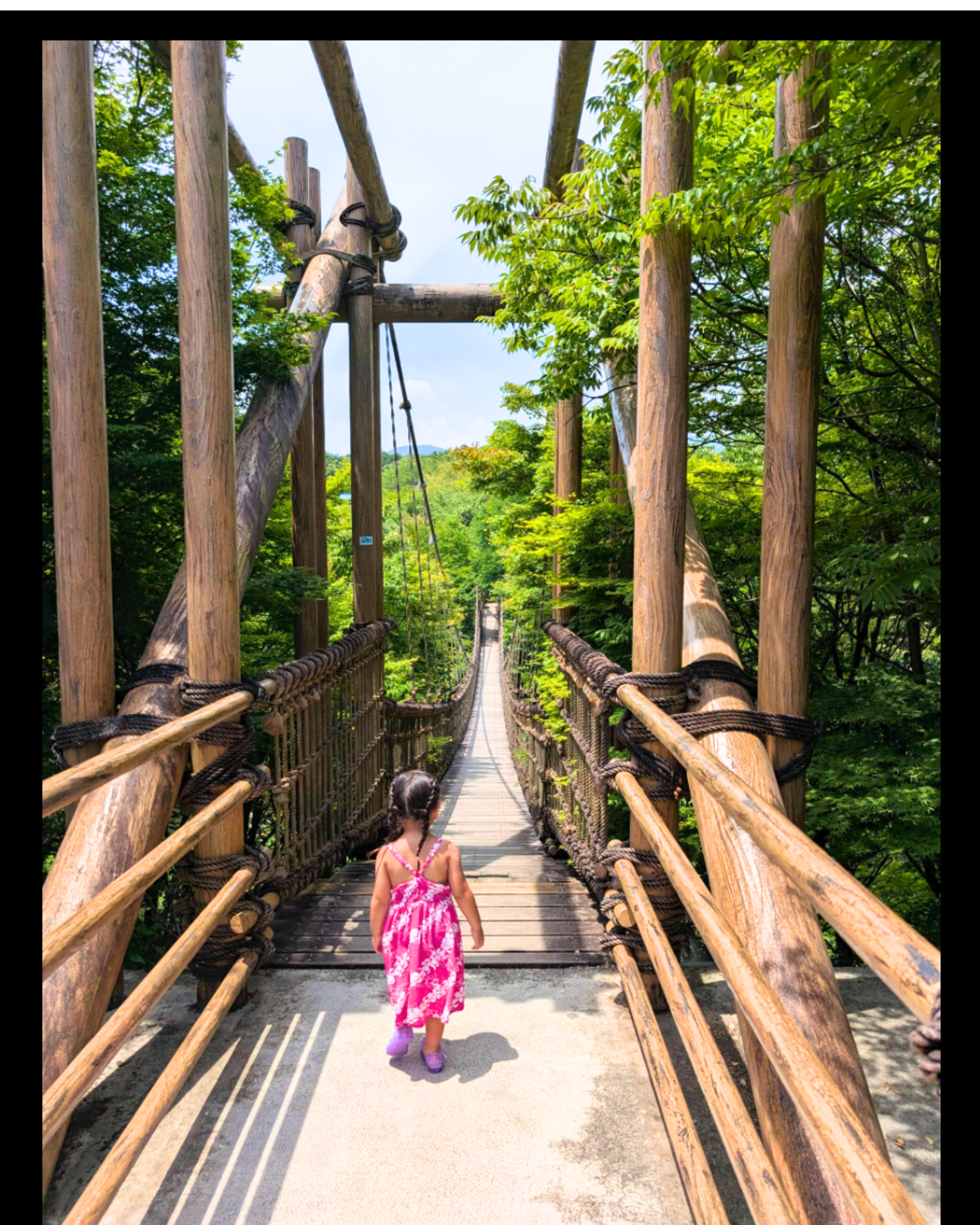 Child on suspension bridge