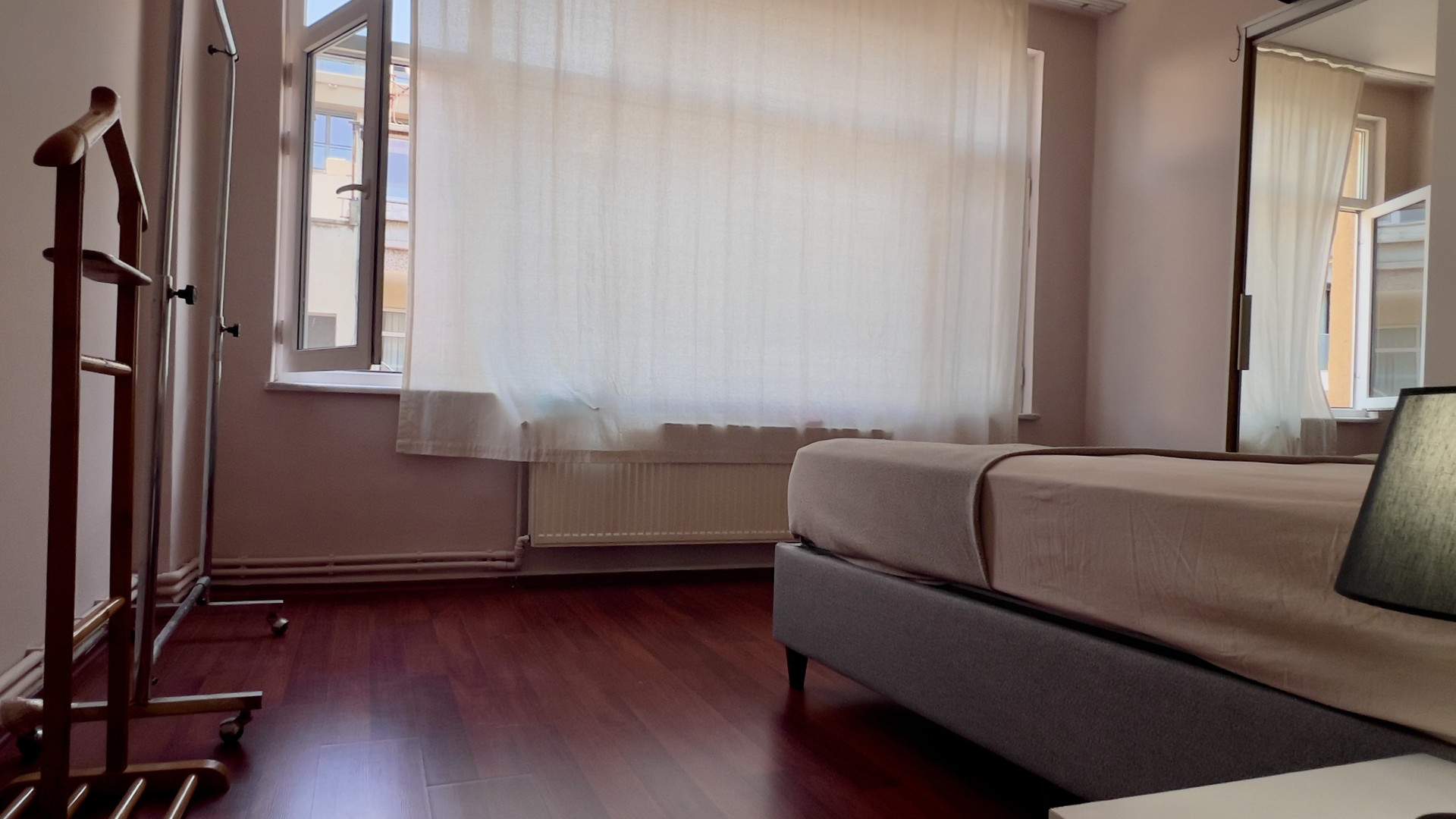 Bright bedroom with hardwood floors