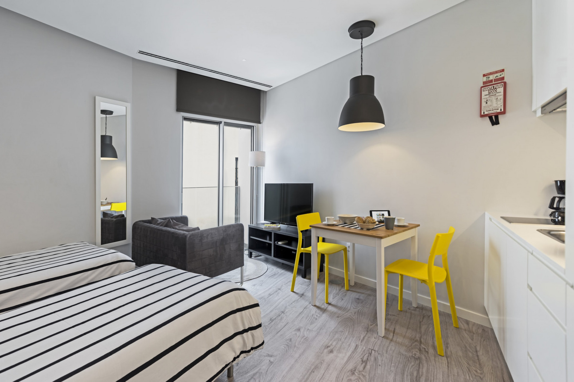 Bedroom with two single beds , living room, dining room and kitchen