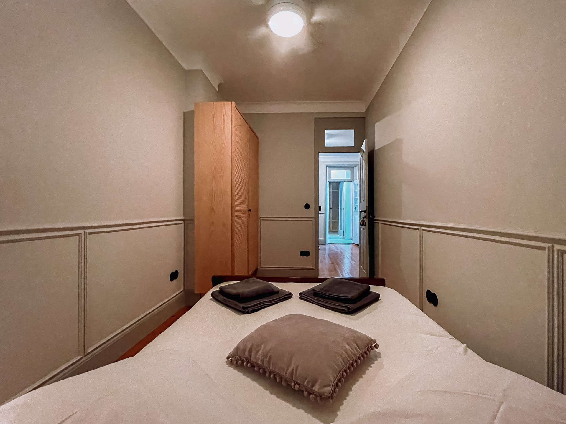 Bedroom with wardrobe and hallway view
