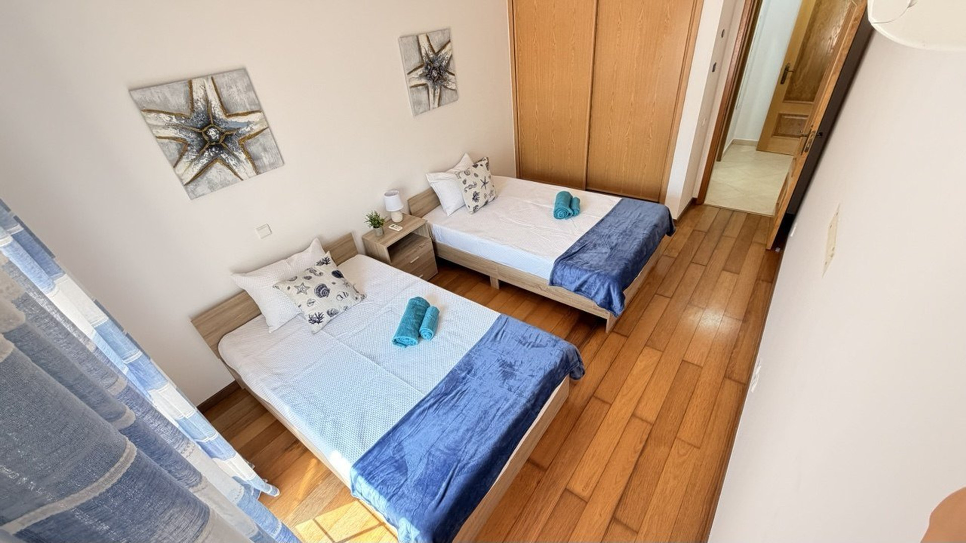 Twin bedroom with starfish decor