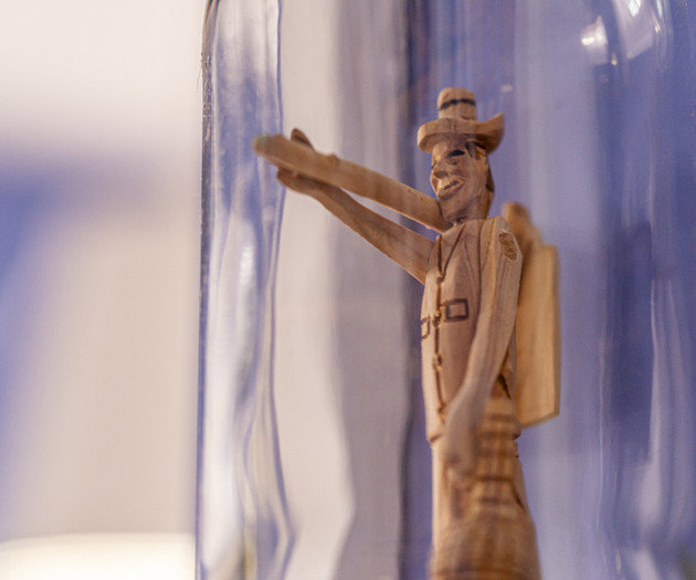 Wooden figurine in bottle