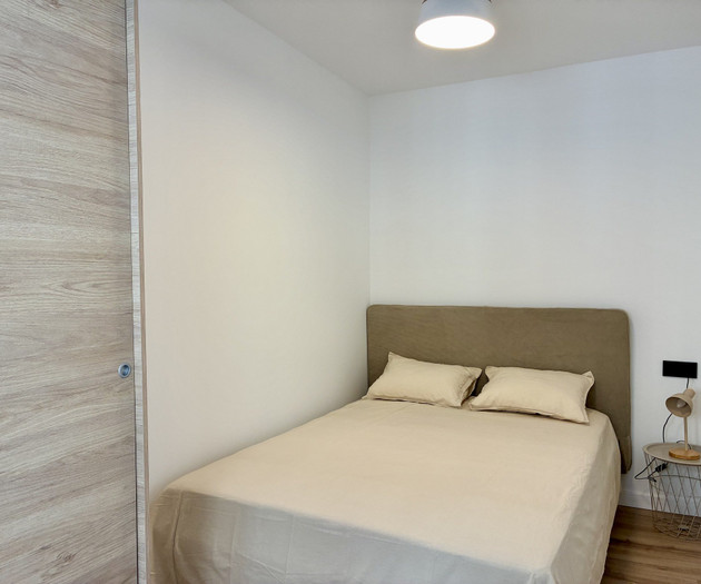 Bedroom with upholstered headboard