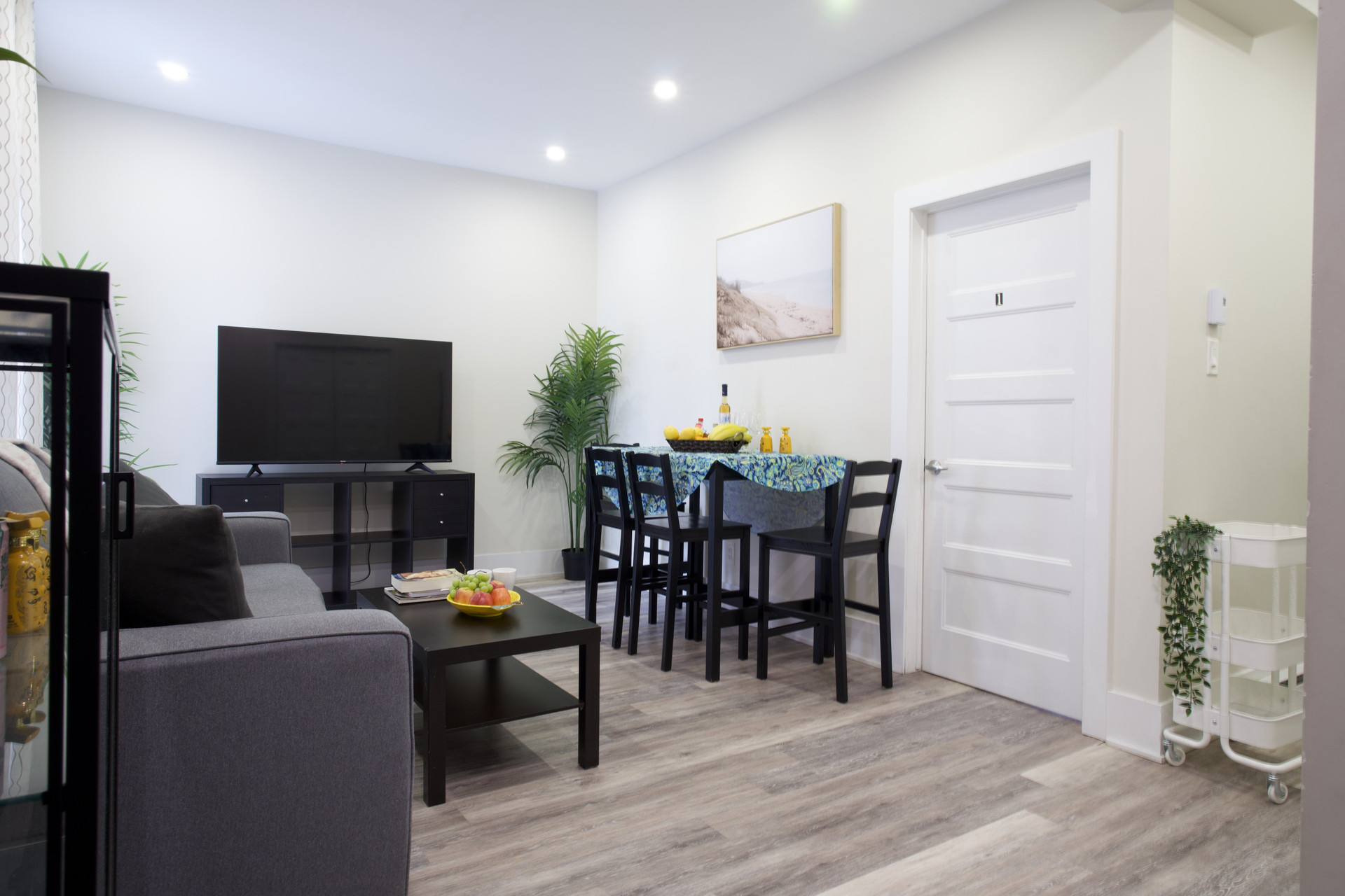 Living room with dining table and TV