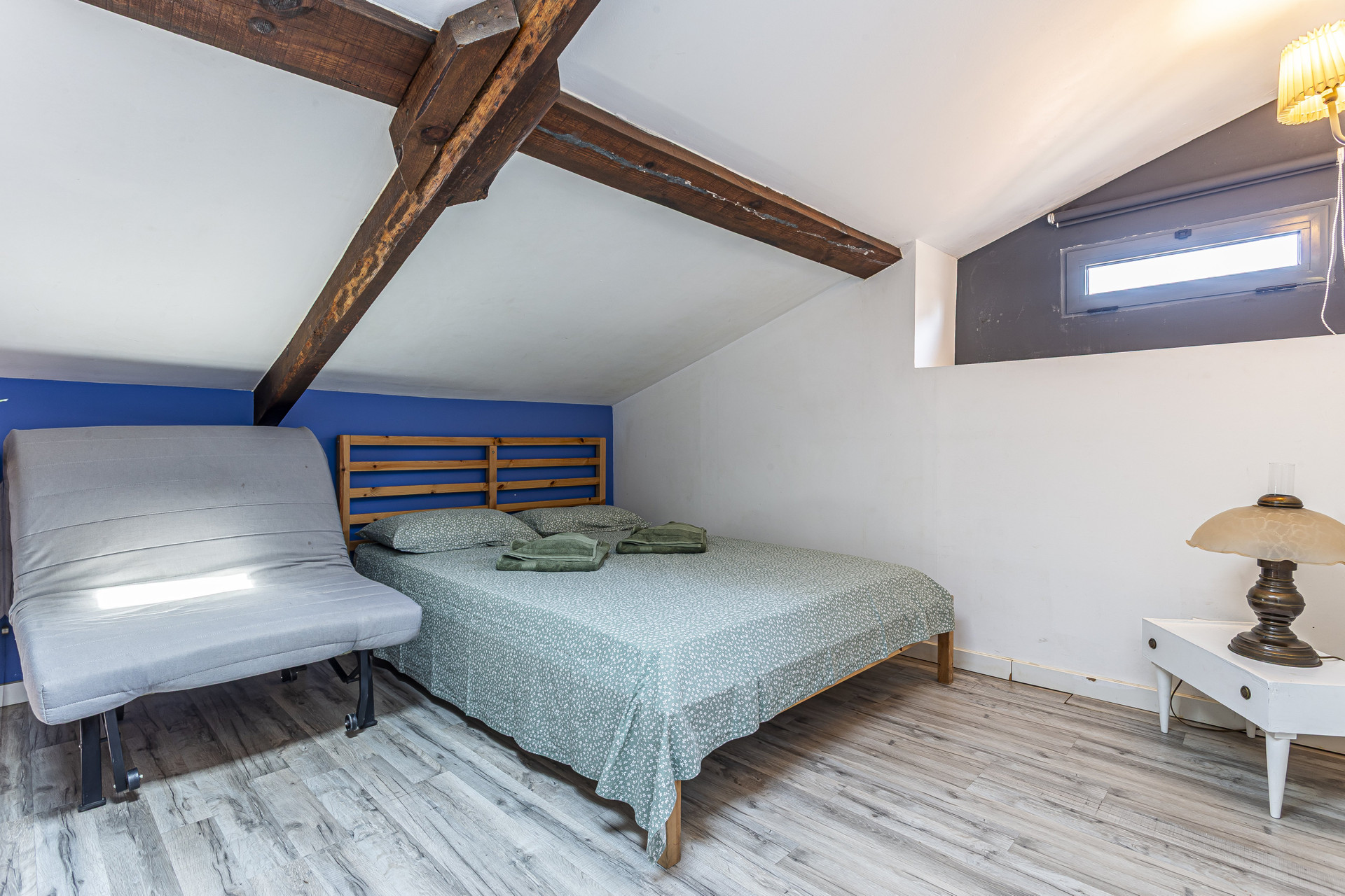 Loft bedroom with sofa chair