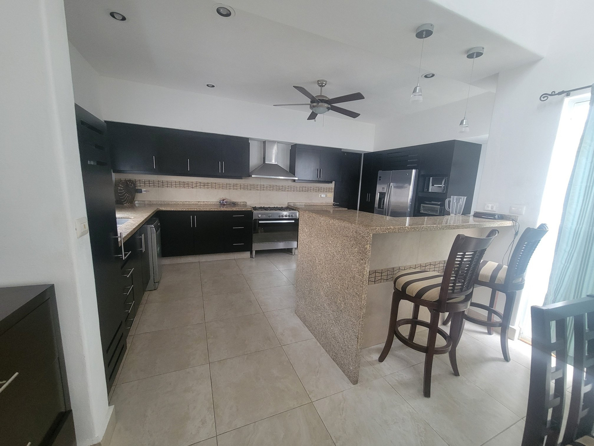Open kitchen with bar seating