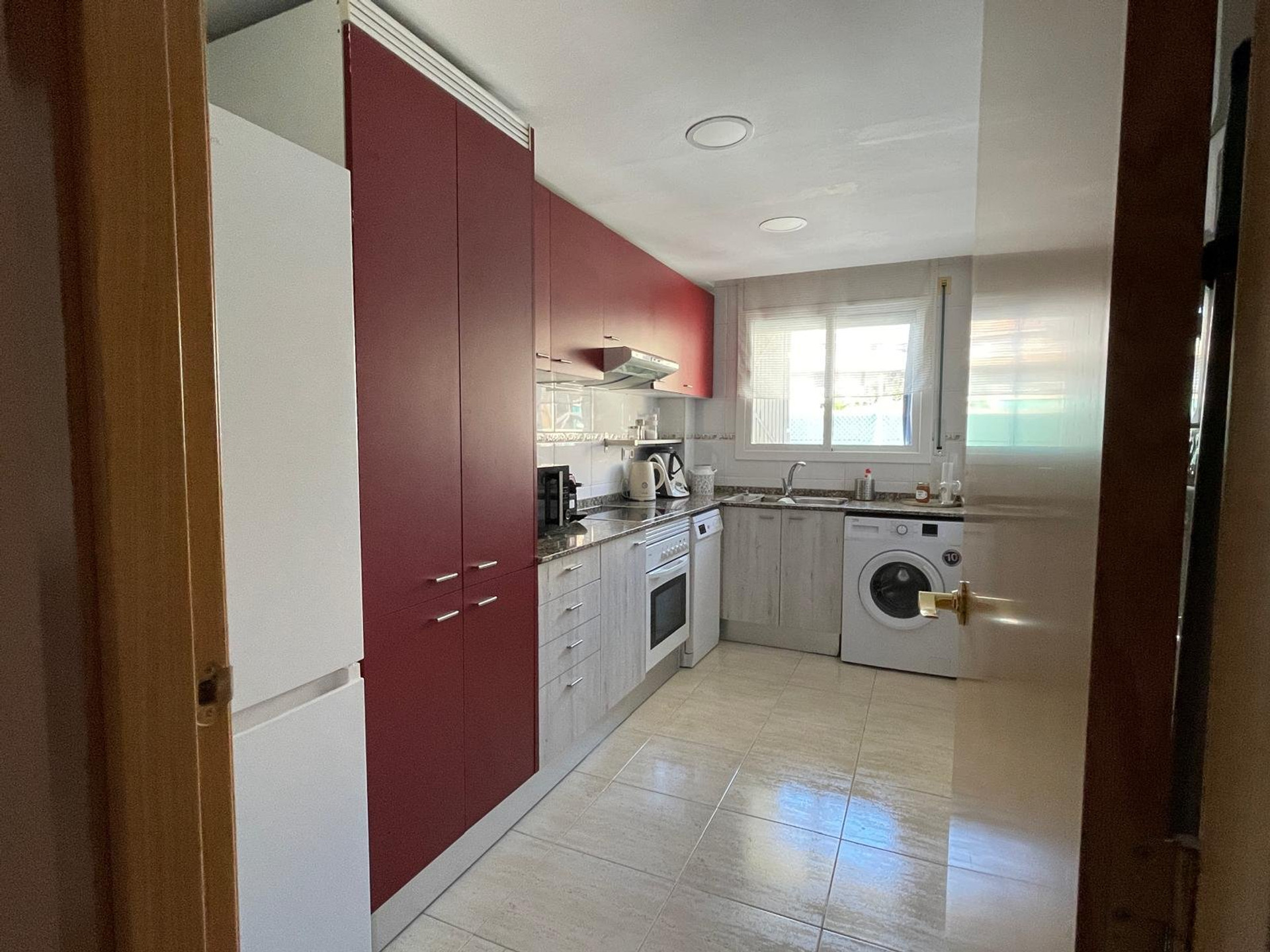 Kitchen with laundry appliances