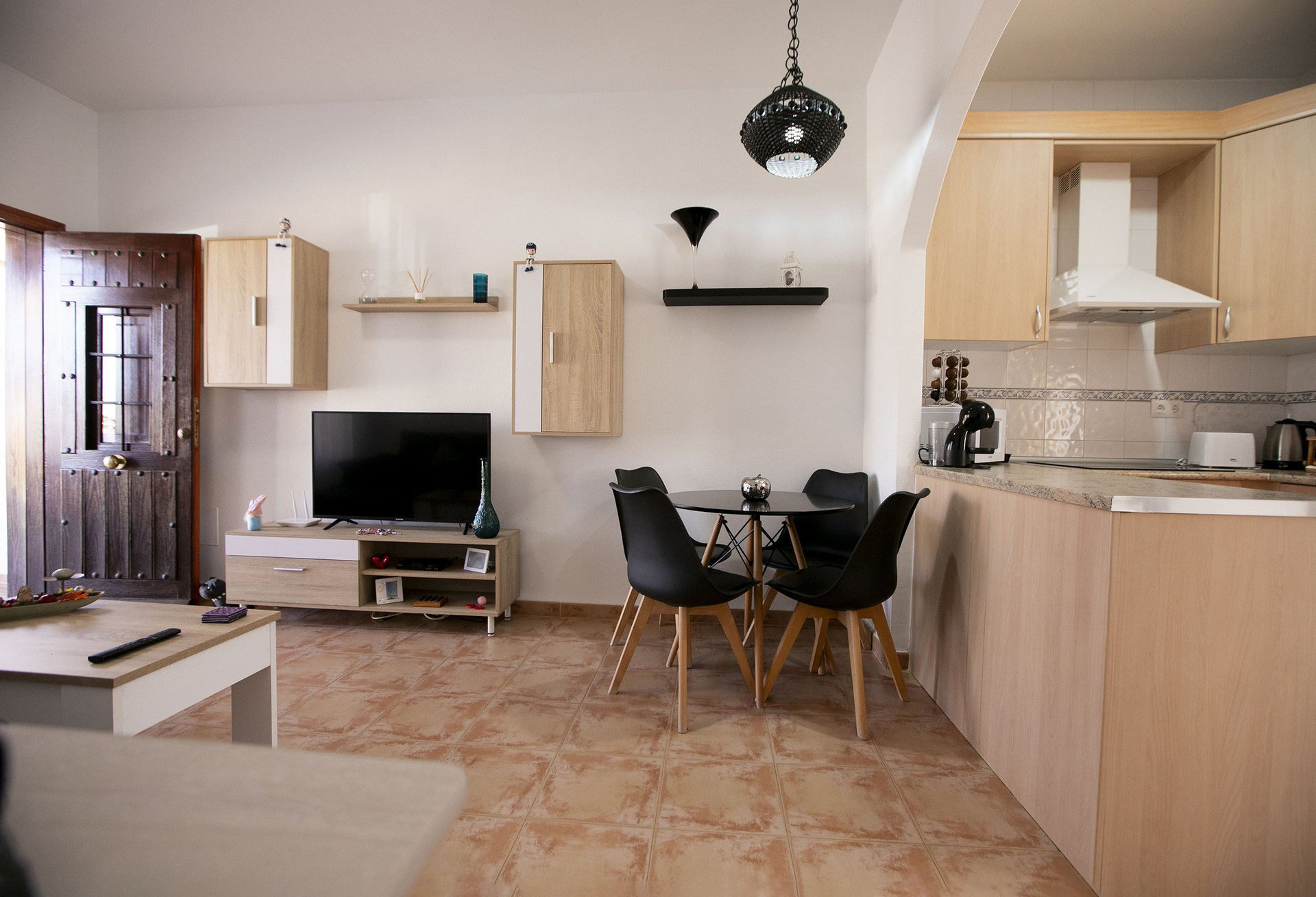 Living room with TV and kitchen