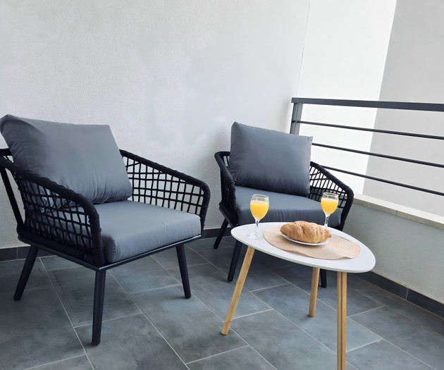Balcony seating with breakfast setup