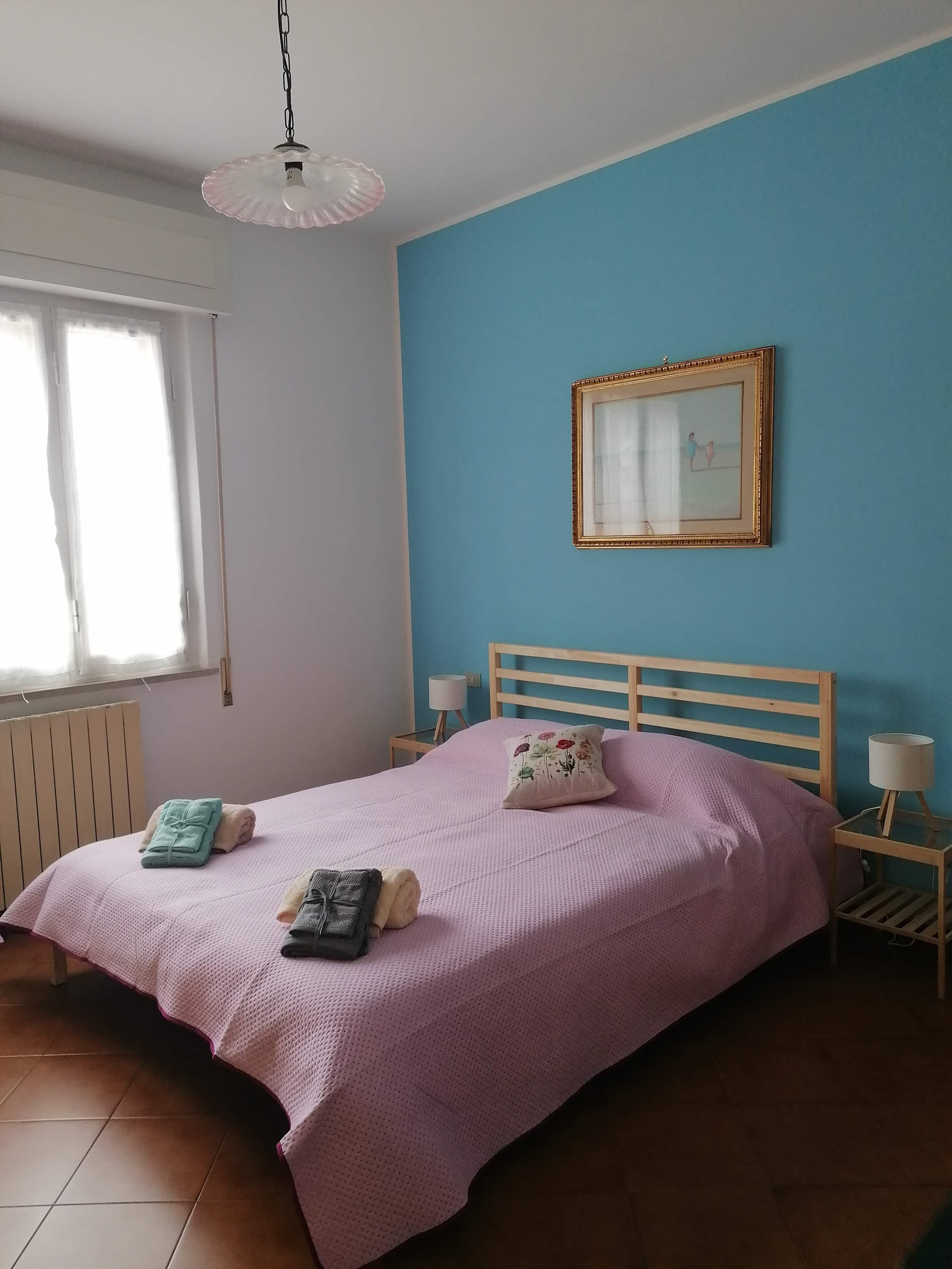 Bedroom with blue accent wall
