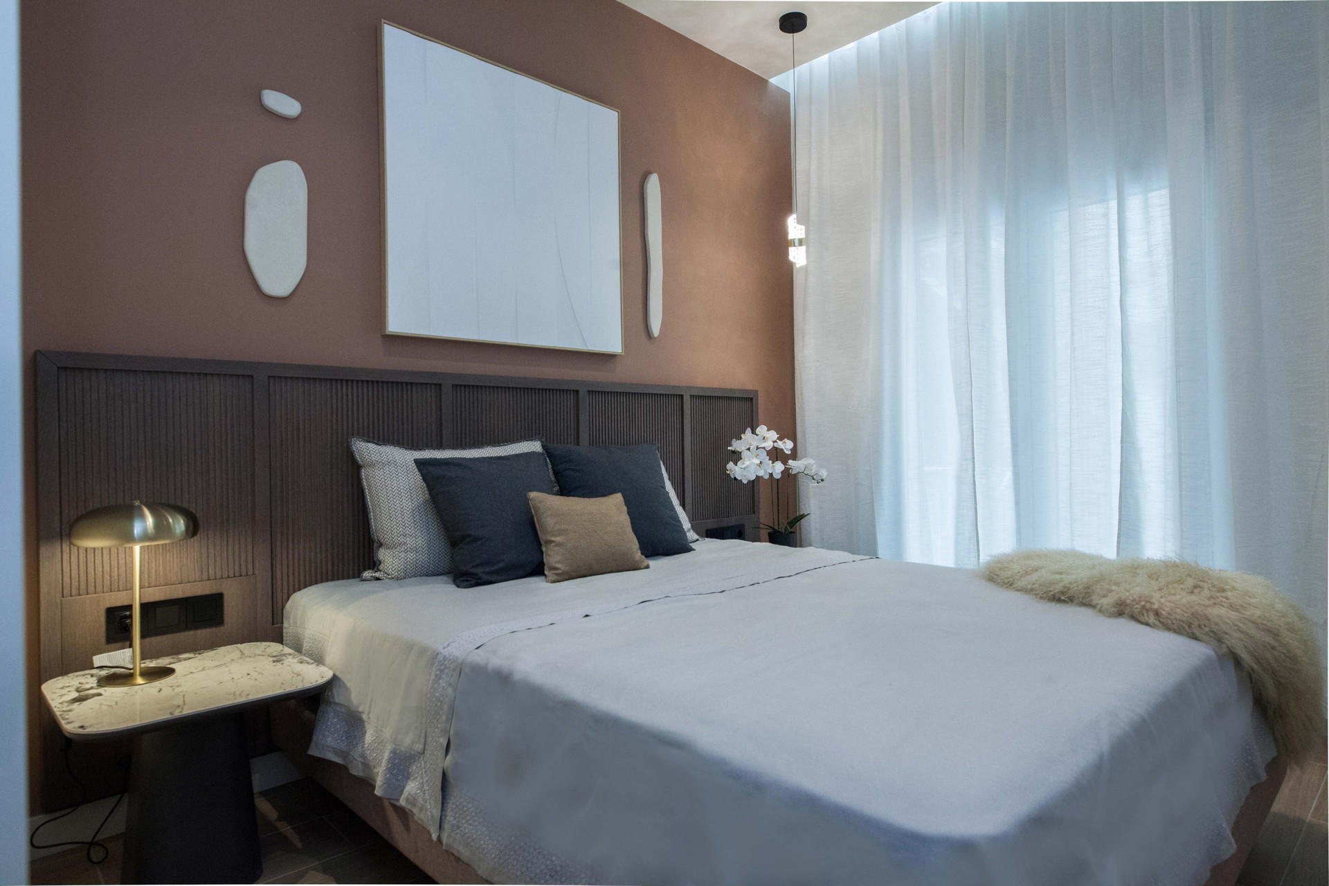 Elegant bedroom with dark headboard wall