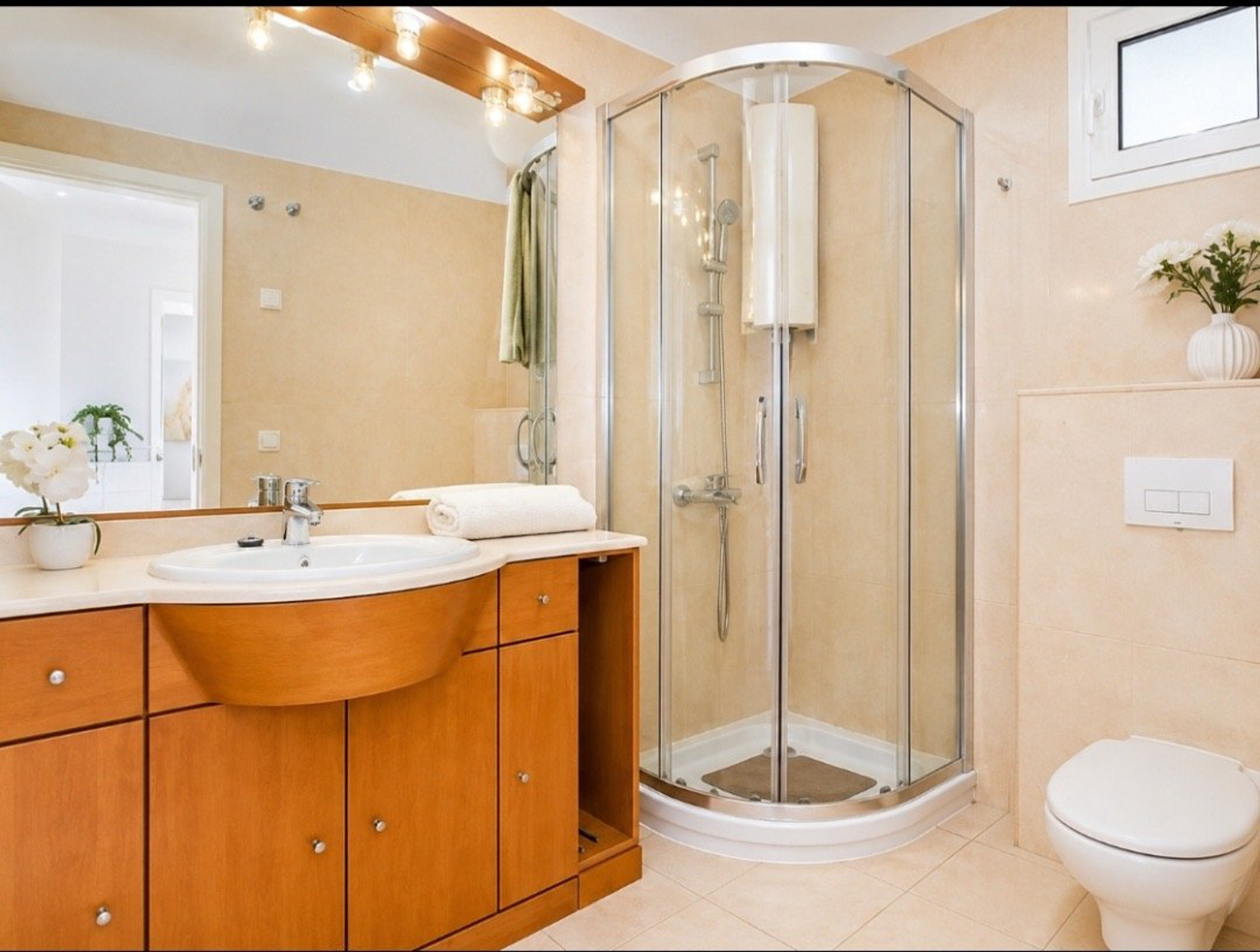 Bathroom with shower and wooden vanity