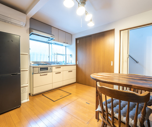Kitchen with dining table and fridge