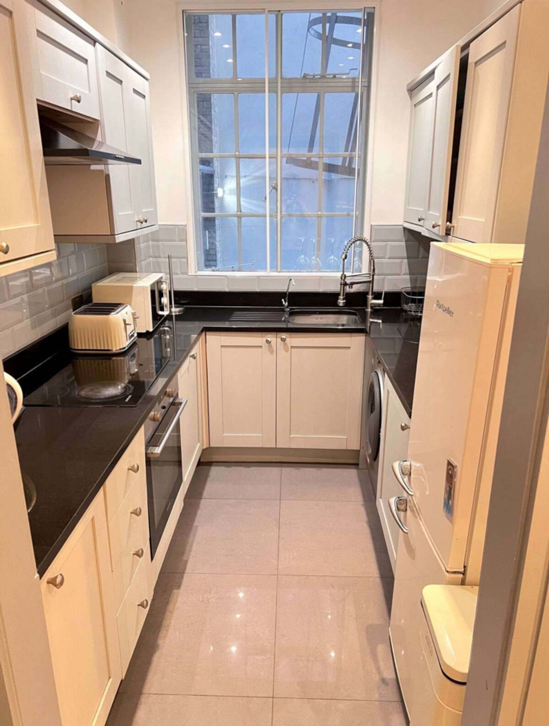 Newly renovated kitchen with black marble finishing